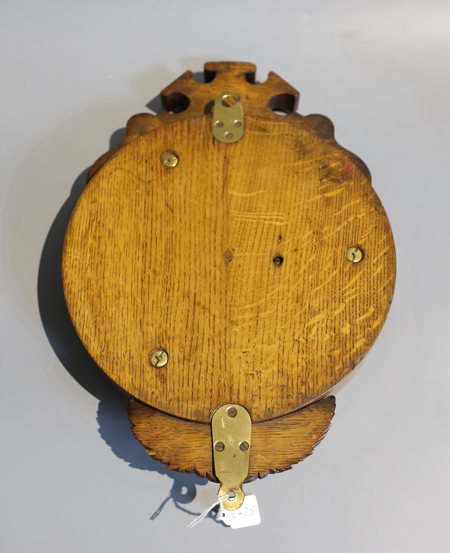 A late Victorian carved oak cased aneroid barometer and thermometer by Dollond, London, numbered 5491, height 40cm